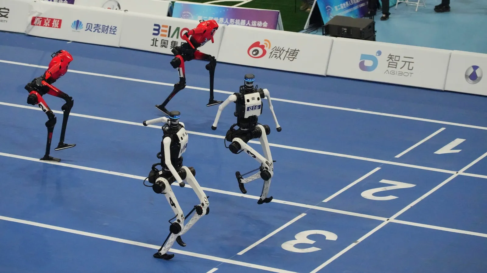 Humanoid robots compete in the 100m final race during the World Humanoid Robot Games in Beijing, Wednesday, Aug. 26, 2026. (AP Photo/Achmad Ibrahim)(Achmad Ibrahim/AP Photo/Achmad Ibrahim)