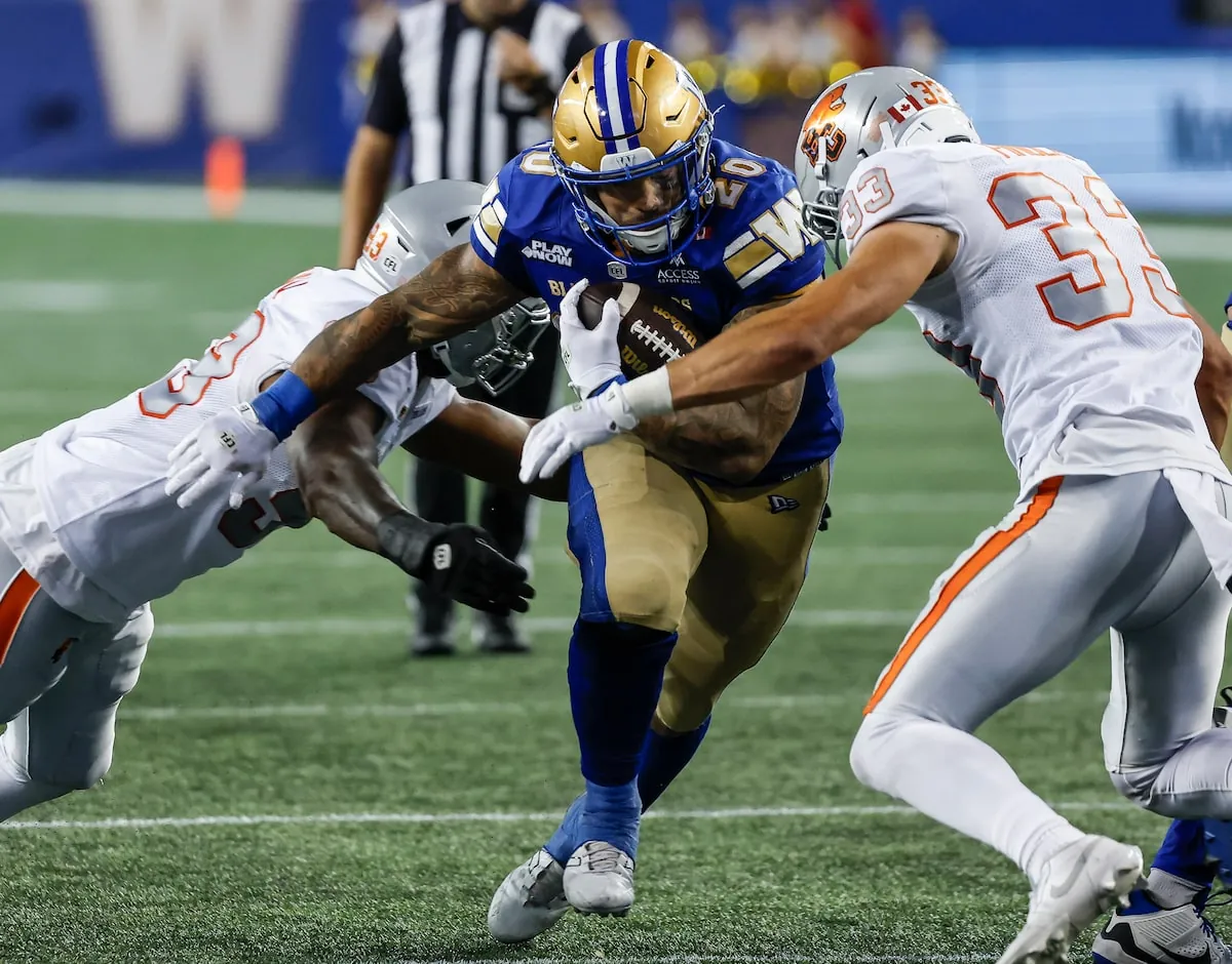 Winnipeg Blue Bombers' running back Brady Oliveira (20) runs for the first down against the B.C. Lions during their game last month in Winnipeg.John Woods/The Canadian Press