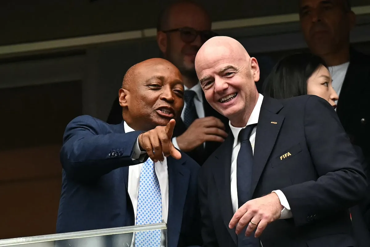 Confederation of African Football (CAF) president Patrice Motsepe (left) points out as he speaks with FIFA president Gianni Infantino ahead of the 2026 World Cup round of 16 football match between Canada and Morocco, in Houston.PAUL ELLIS/AFP/Getty Images